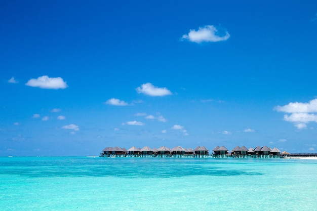 Beach with water bungalows at Maldives