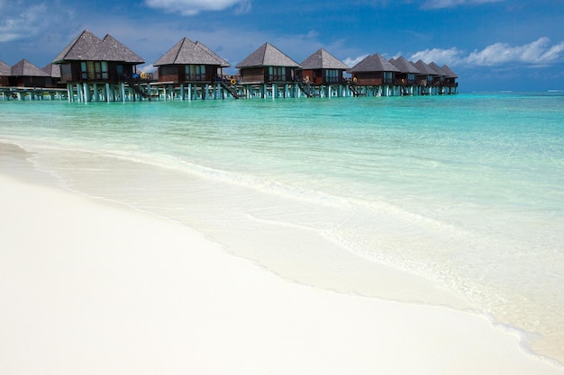 Beach with water bungalows at Maldives