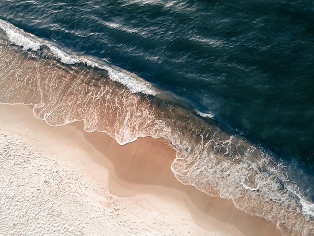 Beach with white sand and the blue sea Aerial top down view