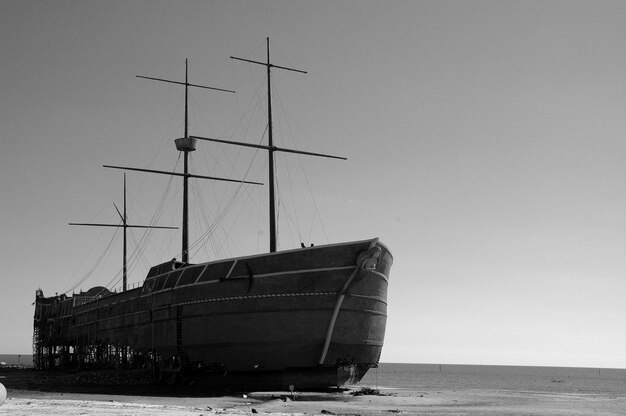 Photo beached and damaged sailing ship run aground