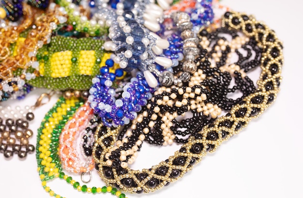 Bead jewelery on white background.