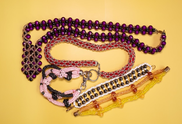 Beads, Jewelery, beads necklace on yellow background.