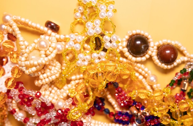 Beads, Jewelery, beads necklace on yellow background.