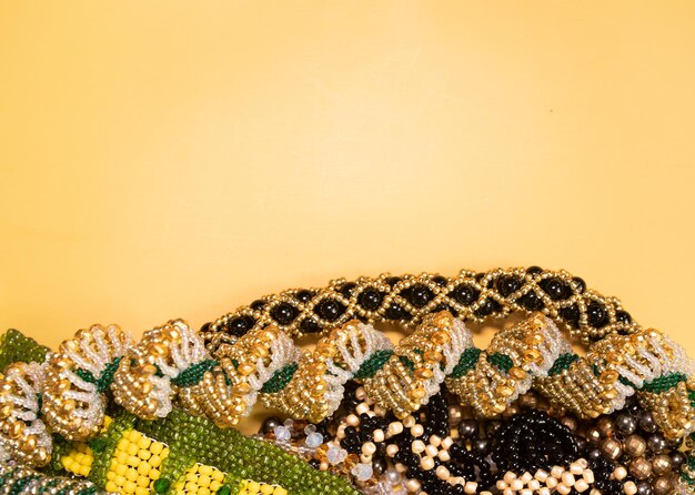 Beads, Jewelery, beads necklace on yellow background.