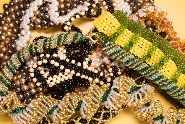 Beads, Jewelery, beads necklace on yellow background.