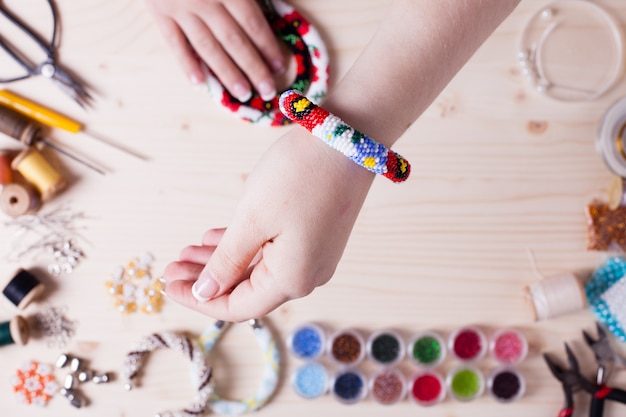 Beads and tools for creating jewelry. Preparation for handmade. Top view