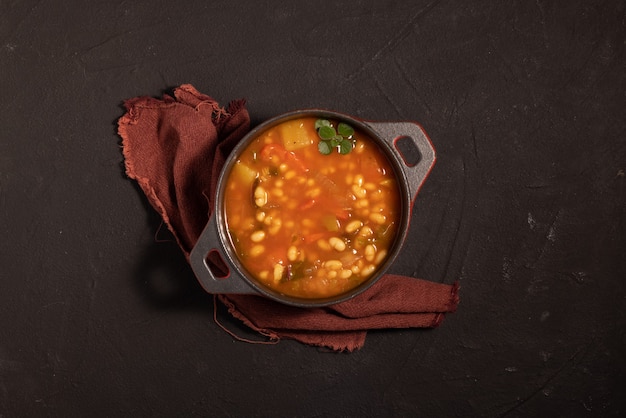 Bean stew on black background