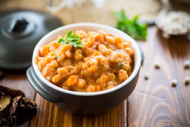 Beans stewed with vegetables and spices in a bowl