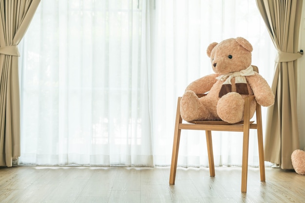 bear doll on chair