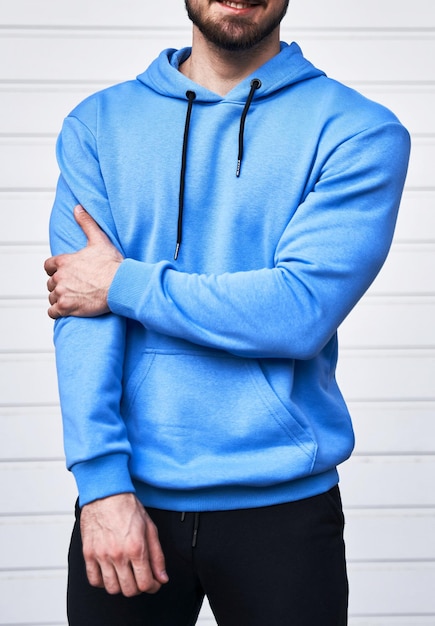 Bearded guy wears blue hoodie no logo color hoodie clothing line mock up