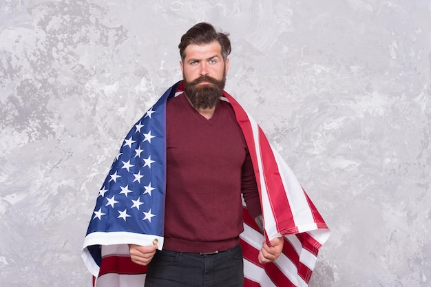 Photo bearded hipster man being patriotic for usa. american education reform in july 4. american citizen at usa flag. american citizen in the election. celebration of victory.