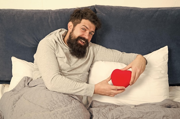 Bearded hipster need some love Lack of love Romantic ideas Vacant place Man relaxing in bed alone Looking for partner Take care of heart Love and relations Valentines day Health care