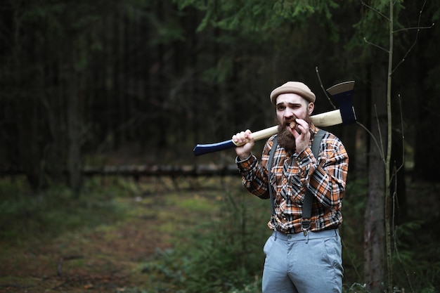 A bearded lumberjack with a large ax