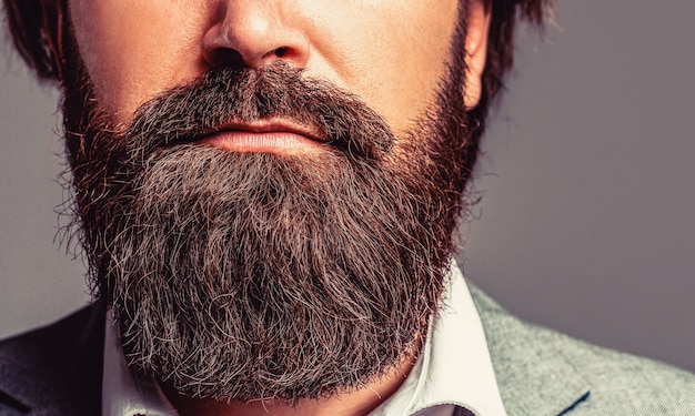 Bearded man close up. Beard is his style. Closeup of bearded mans. Male with mustache growing. Perfect beard. 