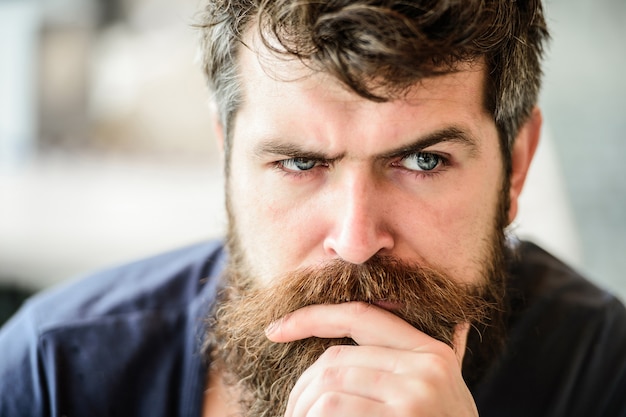 Bearded man feel loneliness. thoughtful man outdoor. Facial skin care. brutal male needs barber. waiting and tinking. Mature hipster with beard hair. Fashion portrait of man.