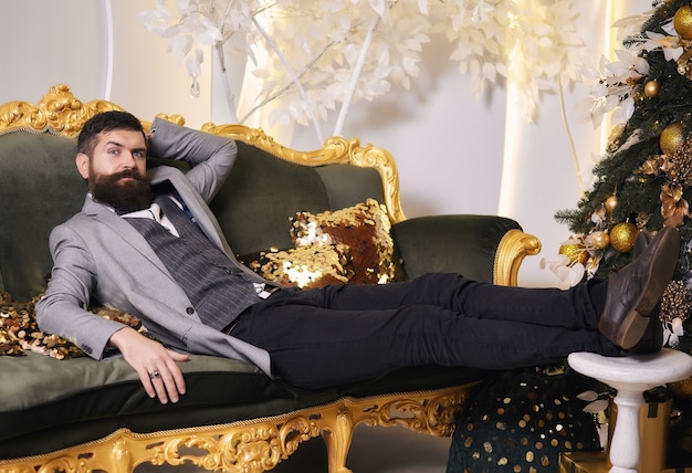 Bearded man relax in luxury apartments eve Christmas holiday