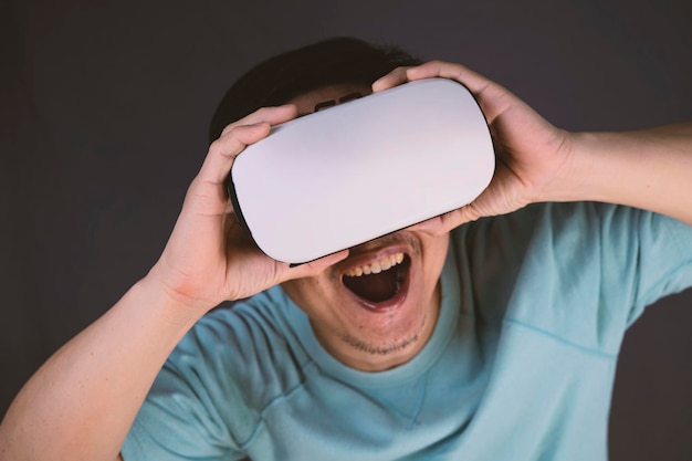 Bearded man wearing virtual reality goggles in modern coworking studio Smartphone using with VR headset