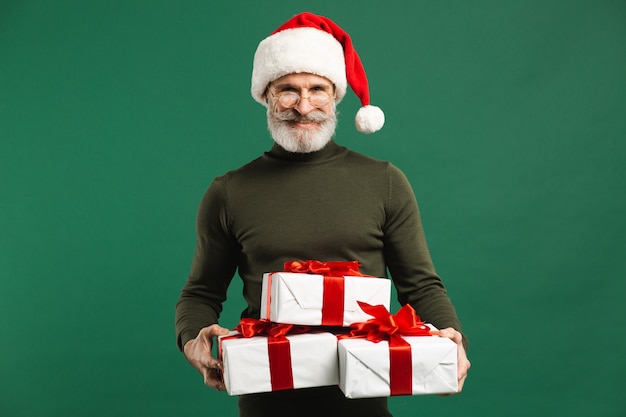 Bearded modern Santa Claus holding gifts