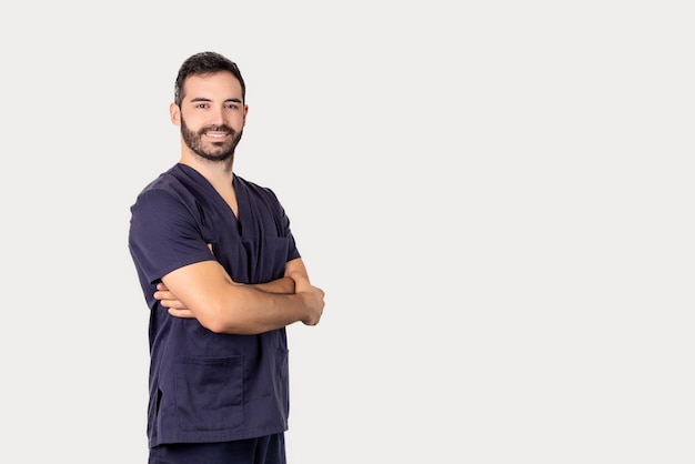 Bearded physiotherapist posing smiling with arms folded