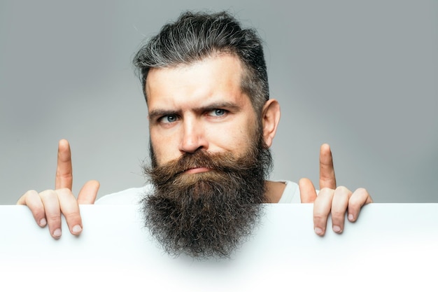 Bearded thougtful man with paper