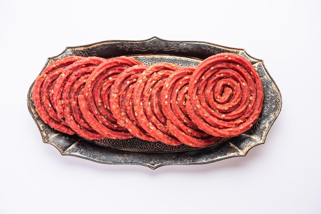 Beatroot chakli murukku Beetroot chakli a spiral fried snack from India made in Diwali festival