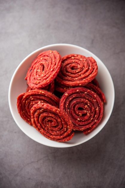 Beatroot chakli murukku Beetroot chakli a spiral fried snack from India made in Diwali festival