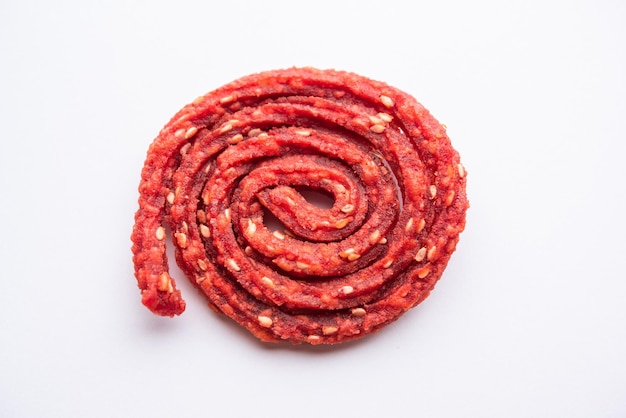 Beatroot chakli murukku Beetroot chakli a spiral fried snack from India made in Diwali festival