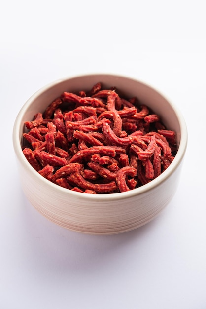 Beatroot chakli sticks made using beetroot fried tea time snack from India