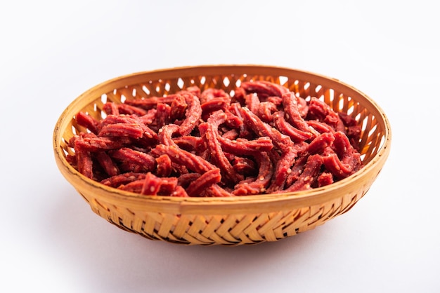 Beatroot chakli sticks made using beetroot fried tea time snack from India