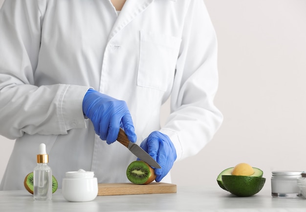 Beautician preparing natural cosmetic, closeup