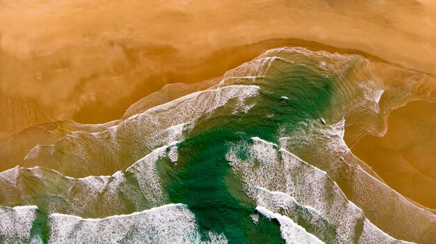 Beautiful aerial view of a beach with waves 