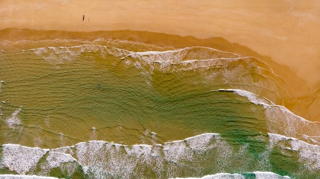 Beautiful aerial view of a beach with waves 