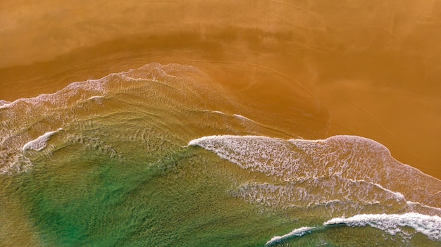 Beautiful aerial view of a beach with waves 