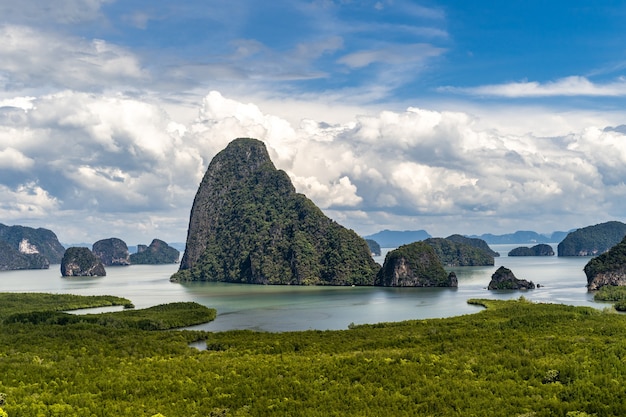 Beautiful aerial view of Samed Nang Chee bay in Phang Nga, Thailand on a bright sunny day with wihte clouds