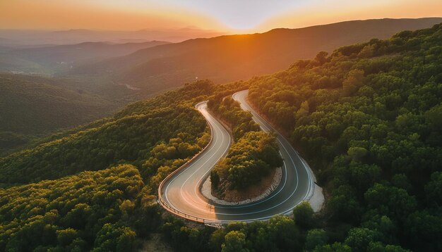 Beautiful aerial view of sunset Winding Road Through Lush Green Hills and clear skies