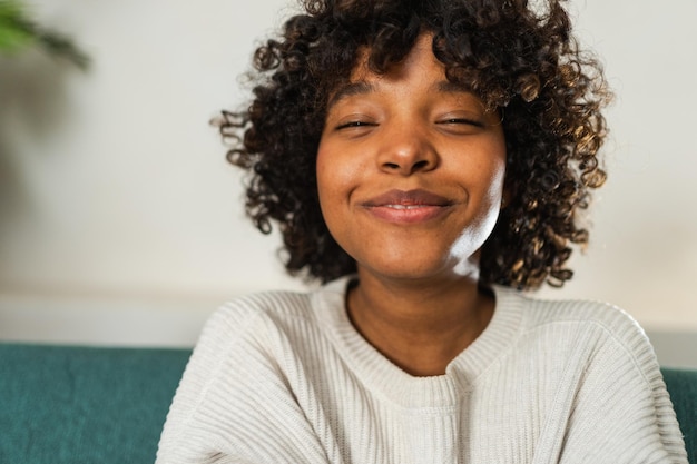 Beautiful african american girl with afro hairstyle smiling close up portrait of young happy black