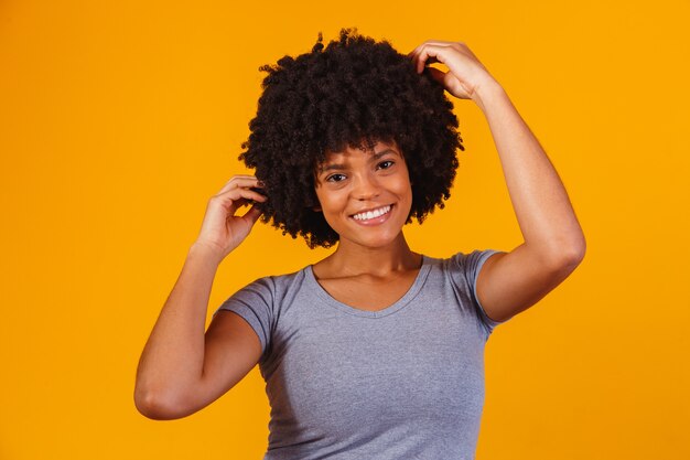 Beautiful african american girl with an afro hairstyle smiling.