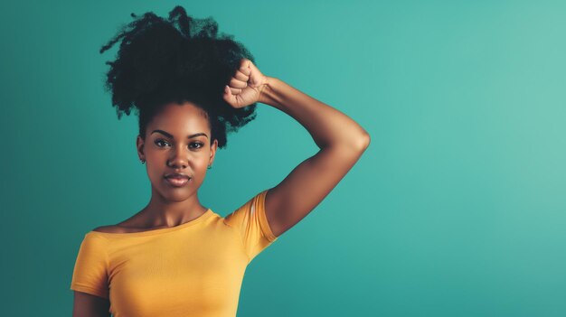 Beautiful african american woman with afro hairstyle on blue background