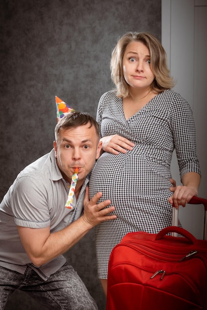 Beautiful amazed pregnant woman with husband ready for childbirth Wife having contraction