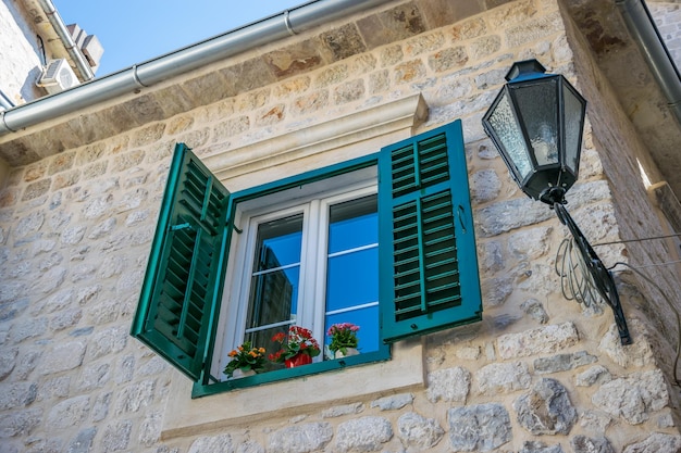 A beautiful antique window on the top floor of a house in the old town