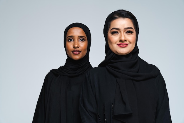 Beautiful arab middleeastern women with traditional abaya in studio