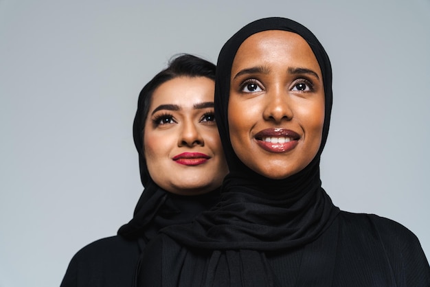 Beautiful arab middleeastern women with traditional abaya in studio