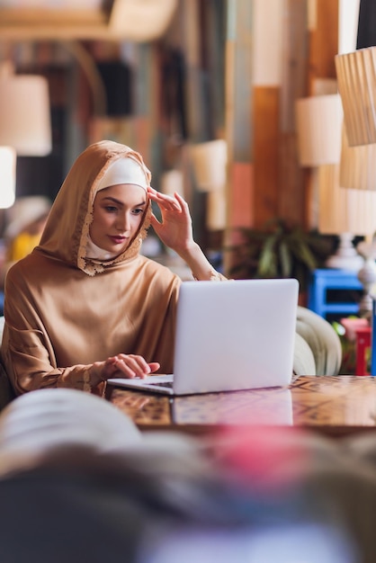 Beautiful arabic business woman working on computer