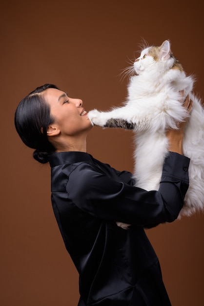  beautiful Asian businesswoman with pet cat