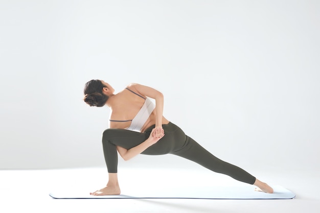 Beautiful asian girl practicing yoga