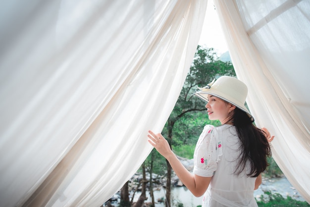 Beautiful Asian tourist visiting Thailand's forest