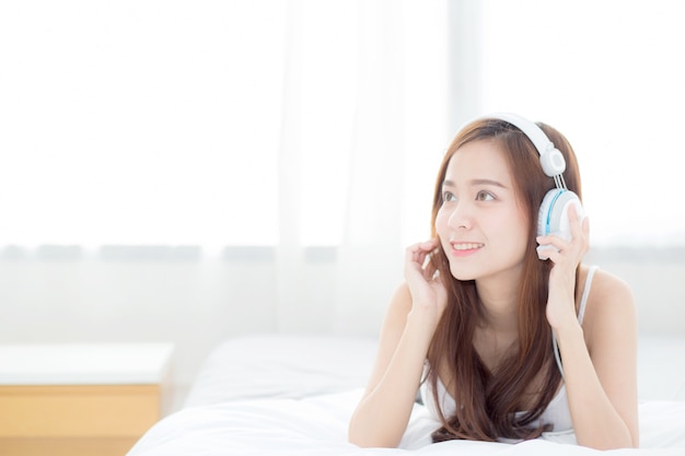 Beautiful asian woman enjoy listen music with headphone