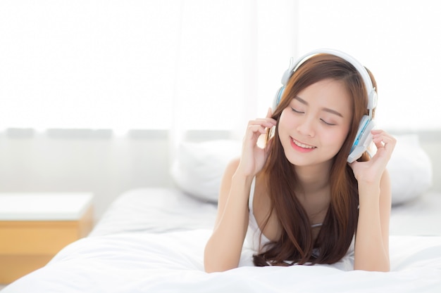 Beautiful asian woman enjoy listen music with headphone