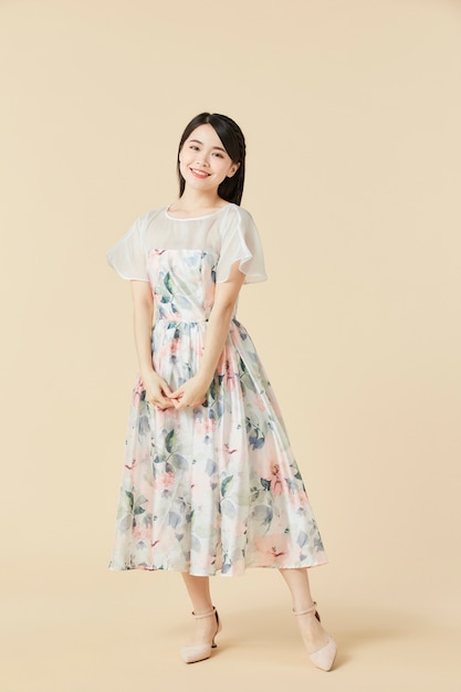 Beautiful Asian woman in a floral dress