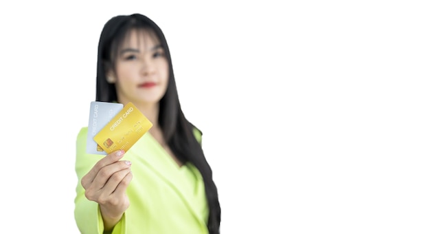 Beautiful Asian woman holding credit card on white background Asian woman smiling showing presenting credit card Woman holding bank business credit card copy space